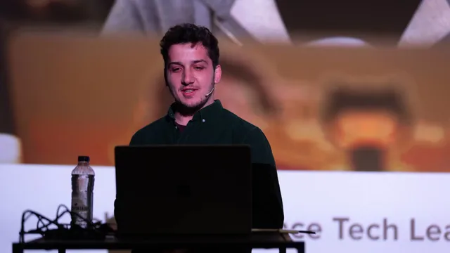 Jeb on stage at Webdevcon 2024, speaking from the lectern